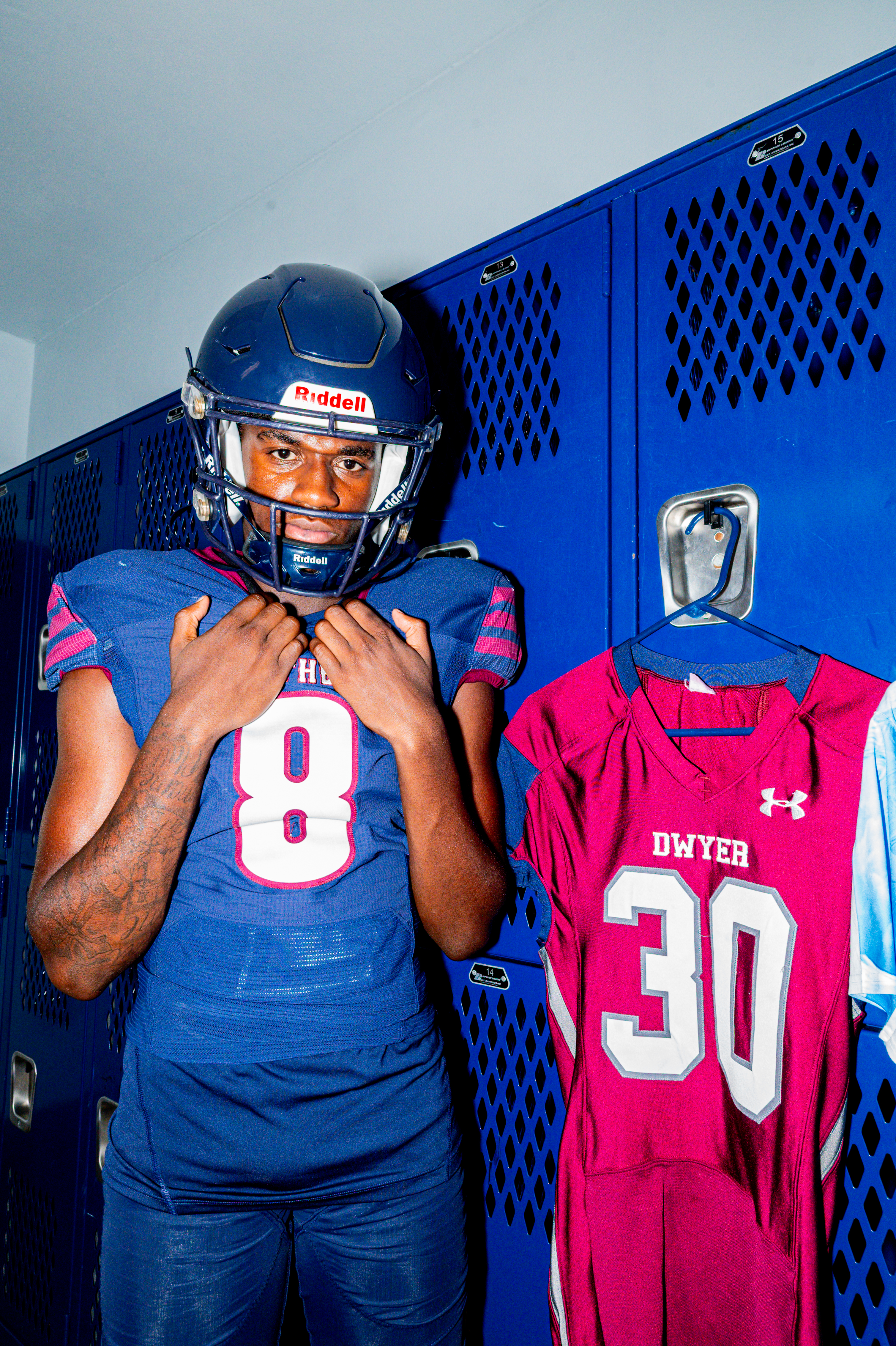 High school athlete suiting up in the locker room
